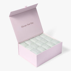 Open pink London Nootropics coffee box full of Mojo adaptogen coffee sachets